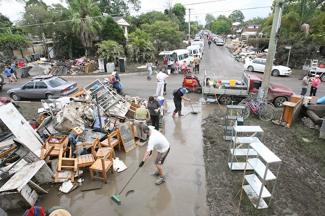 flood emergency plan - people cleaning after flood