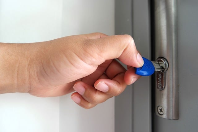 a person opening a door lock