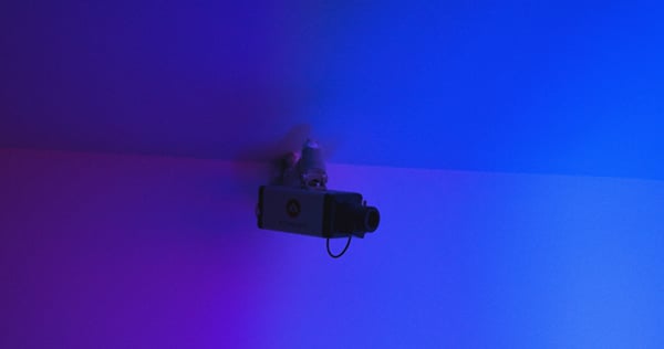 security camera attached in blue-colored room
