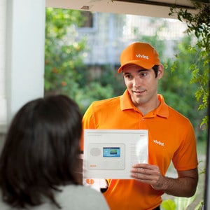 Solicitor in Orange shirt selling Security System