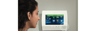 woman speaking through a 2 way voice panel