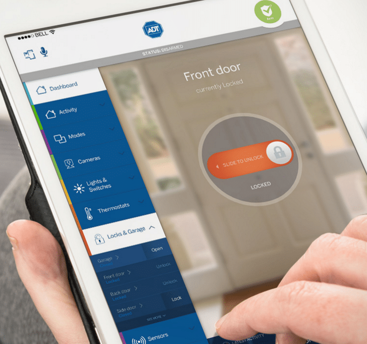 Person using ADT Pulse app on iPad